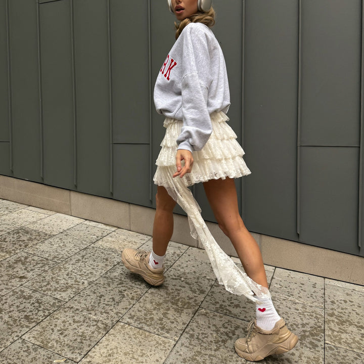 Damer avslappnad oversized-tröja med urban text Mirla-Eva Jonsson