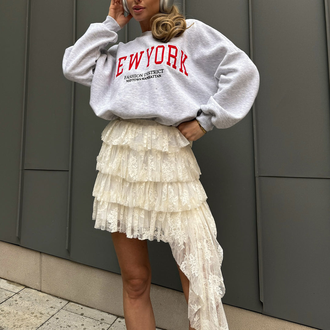 Damer avslappnad oversized-tröja med urban text Mirla-Eva Jonsson
