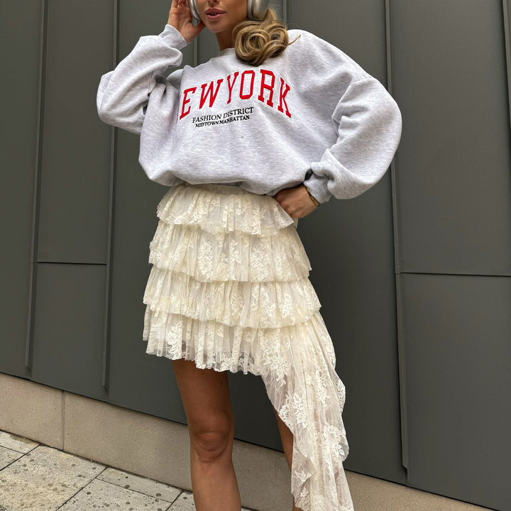 Damer avslappnad oversized-tröja med urban text Mirla-Eva Jonsson