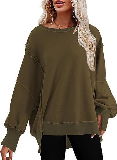 Damer avslappnad oversized tröja med voluminösa ärmar Mirla-Eva Jonsson