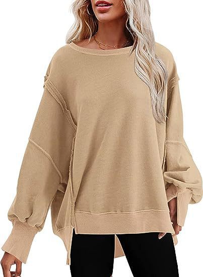 Damer avslappnad oversized tröja med voluminösa ärmar Mirla-Eva Jonsson