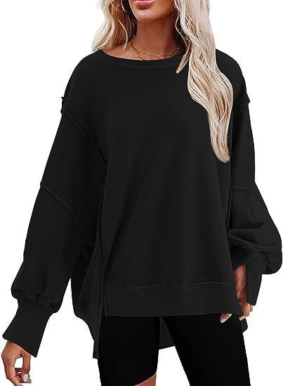 Damer avslappnad oversized tröja med voluminösa ärmar Mirla-Eva Jonsson