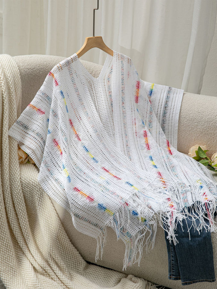 Damer avslappnad poncho med fransiga detaljer och färgglad mönstring Mirla-Eva Jonsson