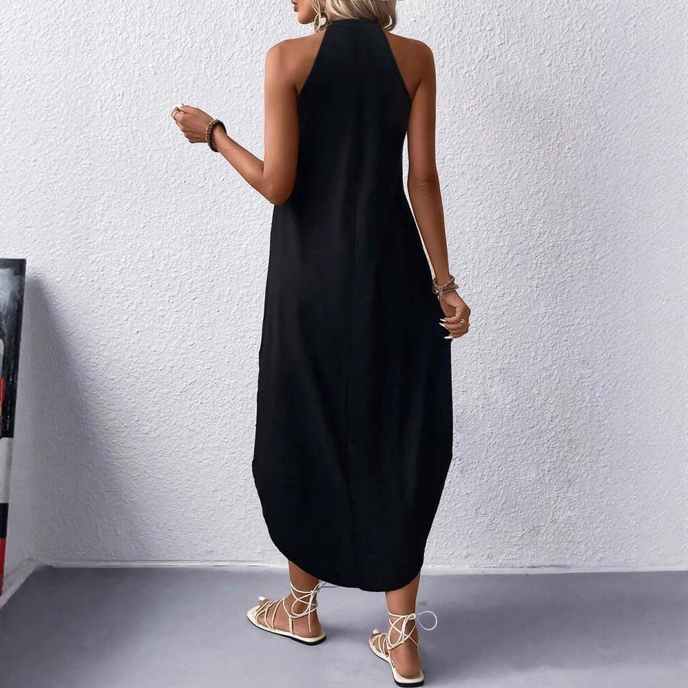 Damer avslappnad sommarmaxi klänning med elegant halterneck och praktiska fickor Mirla-Eva Jonsson
