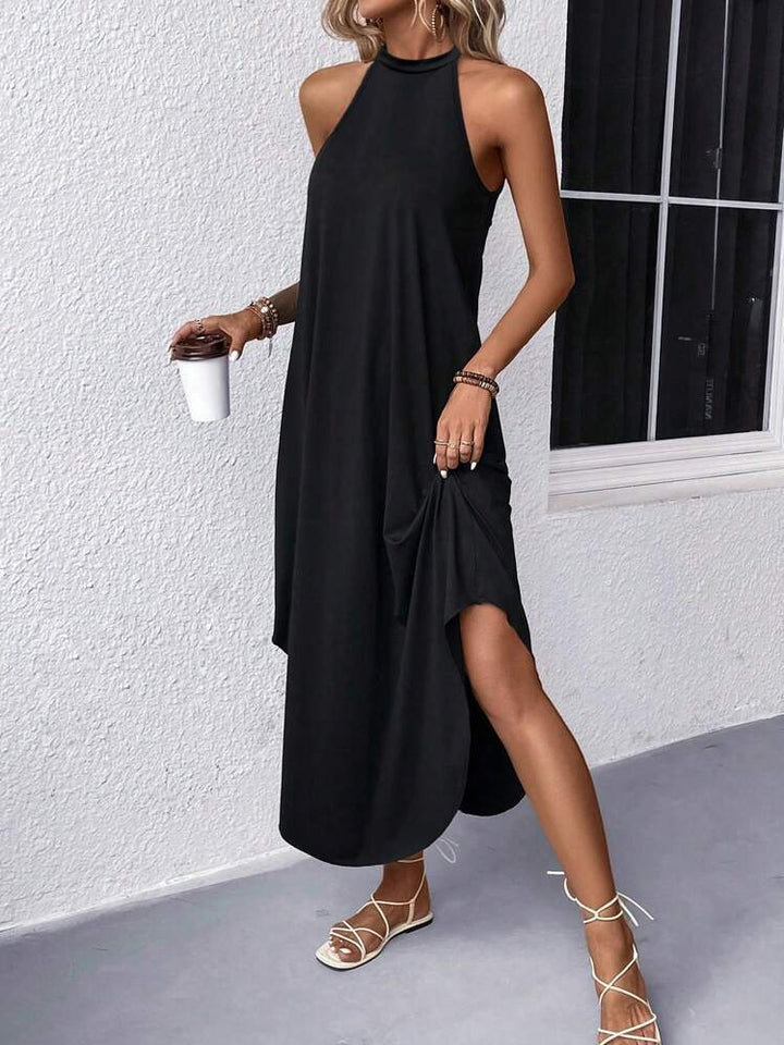 Damer avslappnad sommarmaxi klänning med elegant halterneck och praktiska fickor Mirla-Eva Jonsson