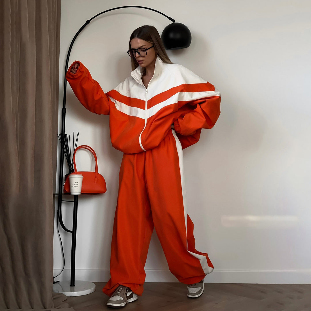 Damer avslappnad sportdräkt med högkvalitativ dragkedja och vida byxor Mirla-Eva Jonsson