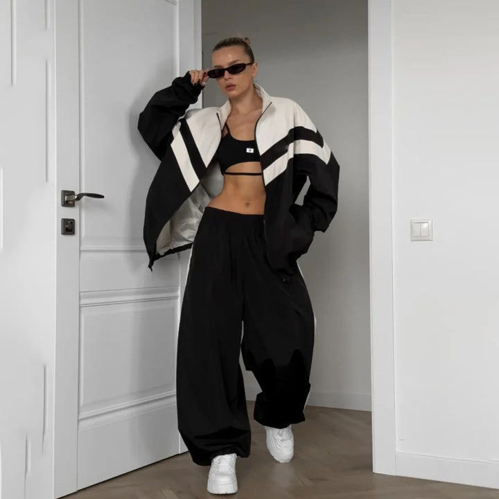 Damer avslappnad sportdräkt med högkvalitativ dragkedja och vida byxor Mirla-Eva Jonsson