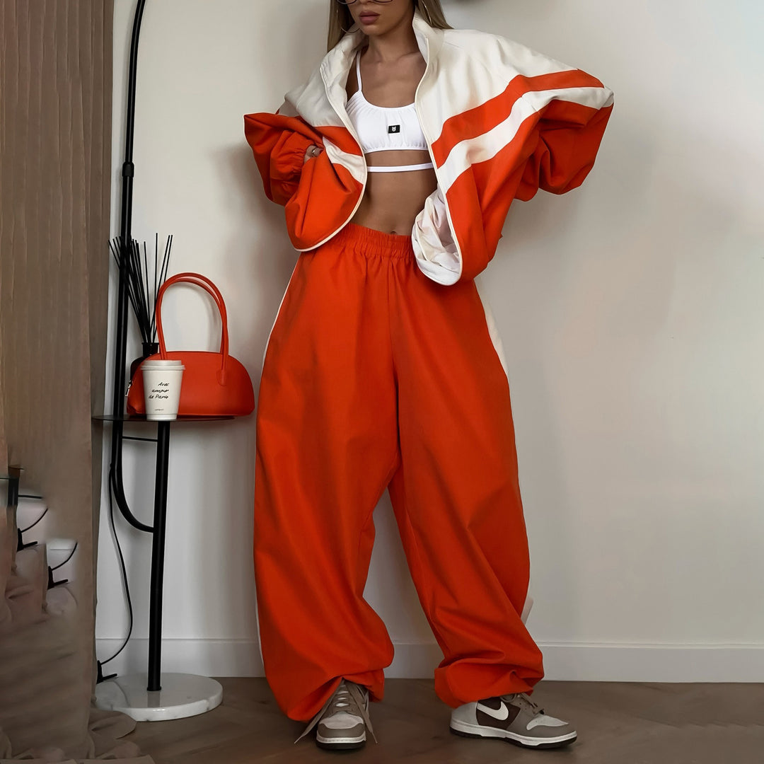 Damer avslappnad sportdräkt med högkvalitativ dragkedja och vida byxor Mirla-Eva Jonsson