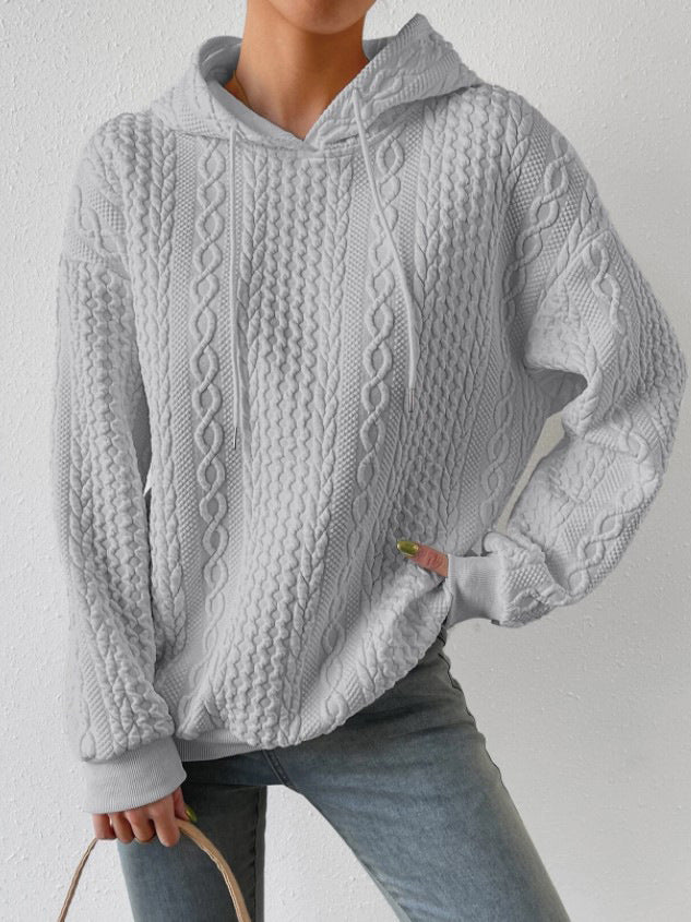 Damer avslappnad stickad tröja med huva och strukturerad design Mirla-Eva Jonsson