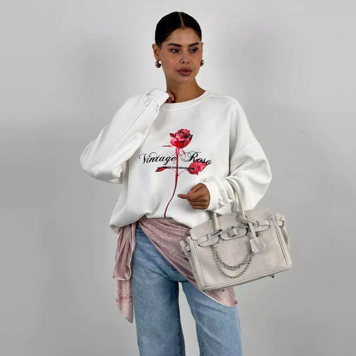 Damer avslappnad sweatshirt med blommig tryck Mirla-Eva Jonsson