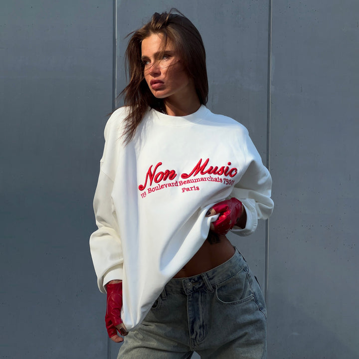 Damer avslappnad sweatshirt med grafisk text Mirla-Eva Jonsson