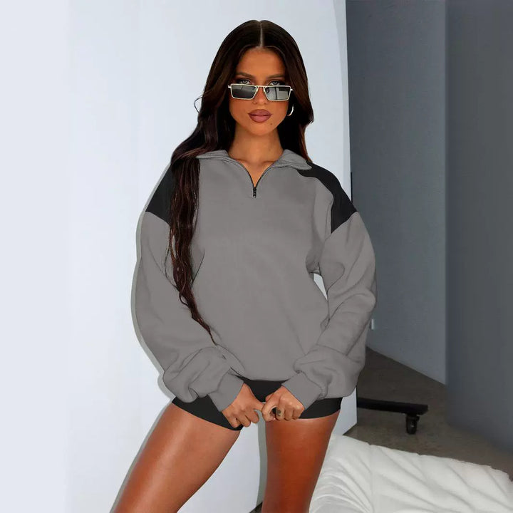 Damer avslappnad sweatshirt med halv dragkedja och kontrasterande ärmar Mirla-Eva Jonsson