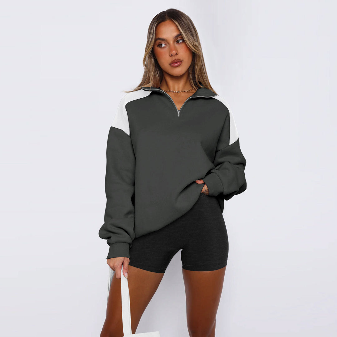 Damer avslappnad sweatshirt med halv dragkedja och kontrasterande ärmar Mirla-Eva Jonsson