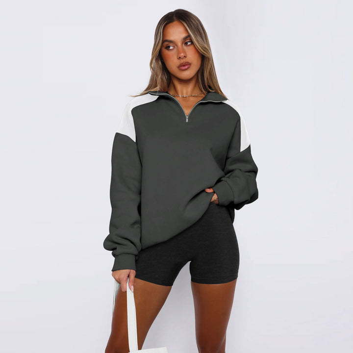 Damer avslappnad sweatshirt med halv dragkedja och kontrasterande ärmar Mirla-Eva Jonsson