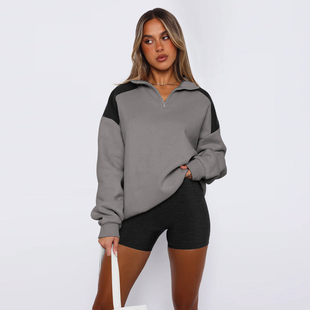 Damer avslappnad sweatshirt med halv dragkedja och kontrasterande ärmar Mirla-Eva Jonsson