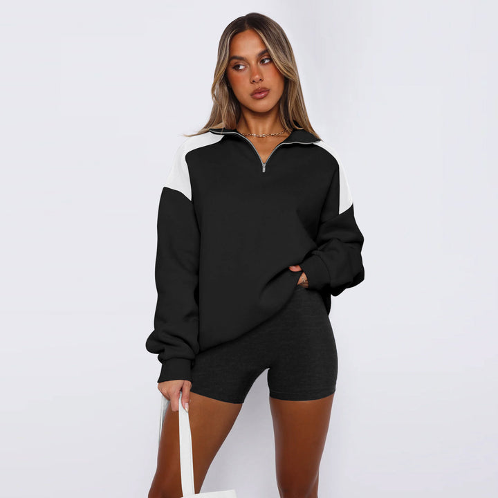Damer avslappnad sweatshirt med halv dragkedja och kontrasterande ärmar Mirla-Eva Jonsson