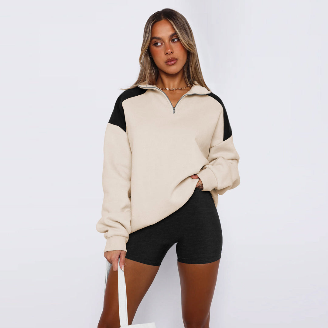 Damer avslappnad sweatshirt med halv dragkedja och kontrasterande ärmar Mirla-Eva Jonsson