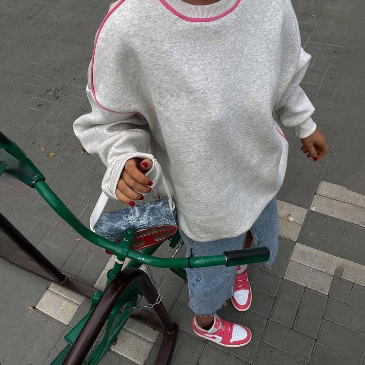 Damer avslappnad sweatshirt med moderna kontraststygn Mirla-Eva Jonsson