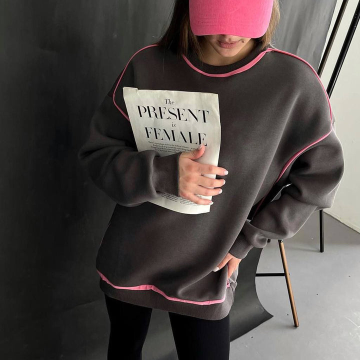 Damer avslappnad sweatshirt med moderna kontraststygn Mirla-Eva Jonsson