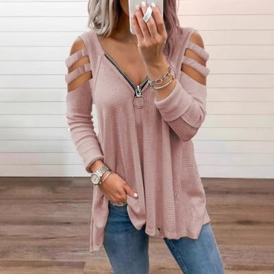 Damer avslappnad topp med trendiga cut-out-detaljer och blixtlås Mirla-Eva Jonsson