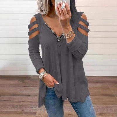 Damer avslappnad topp med trendiga cut-out-detaljer och blixtlås Mirla-Eva Jonsson