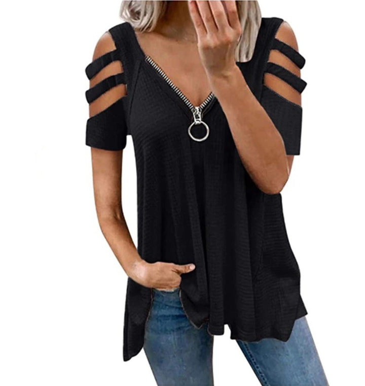 Damer avslappnad topp med trendiga cut-out-detaljer och blixtlås Mirla-Eva Jonsson