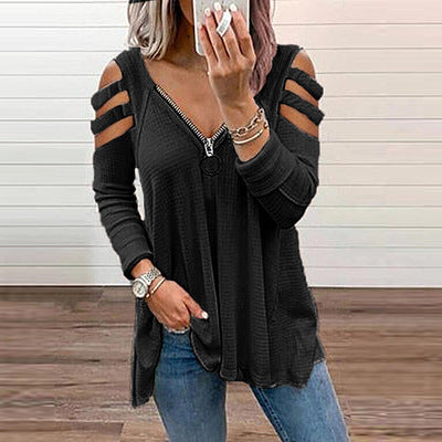 Damer avslappnad topp med trendiga cut-out-detaljer och blixtlås Mirla-Eva Jonsson