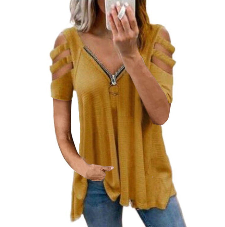 Damer avslappnad topp med trendiga cut-out-detaljer och blixtlås Mirla-Eva Jonsson