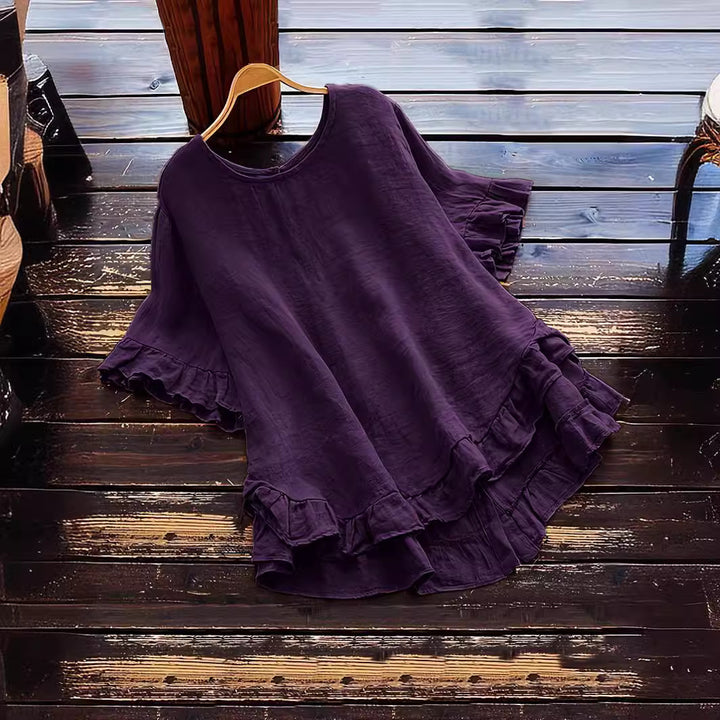 Damer avslappnad topp med volangdetaljer och löst skuren design Mirla-Eva Jonsson