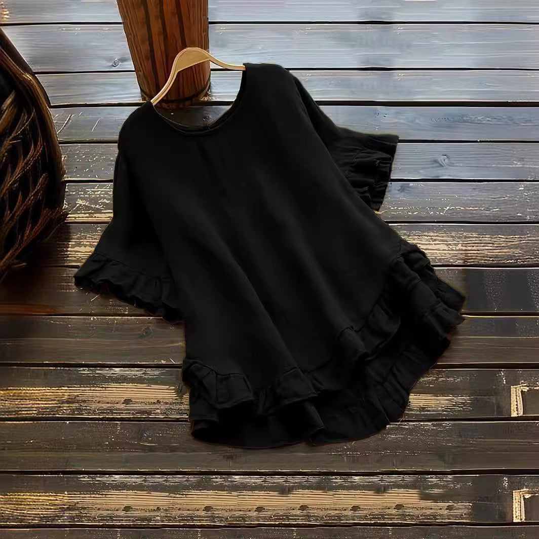 Damer avslappnad topp med volangdetaljer och löst skuren design Mirla-Eva Jonsson