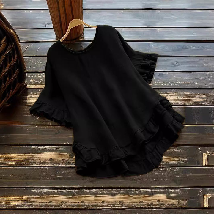 Damer avslappnad topp med volangdetaljer och löst skuren design Mirla-Eva Jonsson