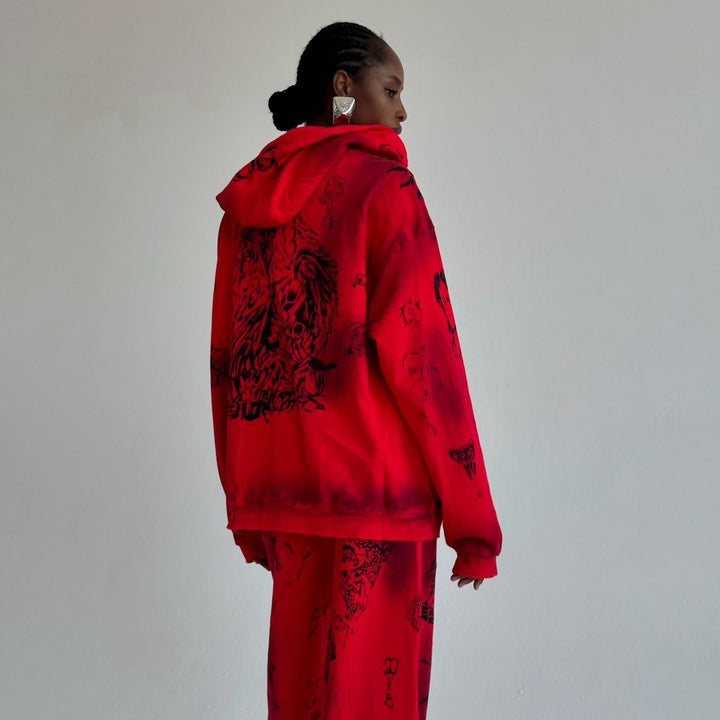 Damer avslappnad zip-hoodie med framträdande grafisk tryck Mirla-Eva Jonsson