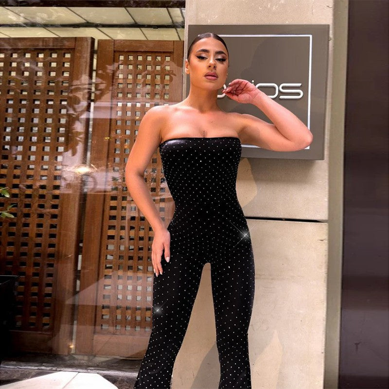 Damer axelbar jumpsuit med eleganta paljetter och skosöljor Mirla-Eva Jonsson
