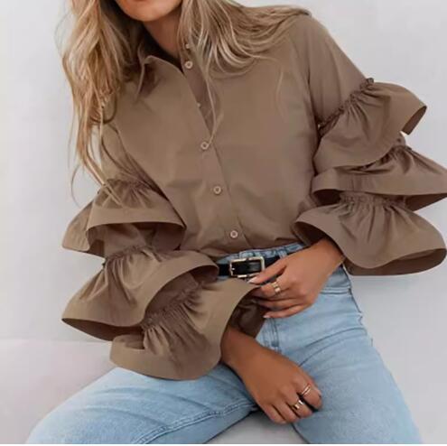 Damer blus med voluminösa volangärmar Mirla-Eva Jonsson
