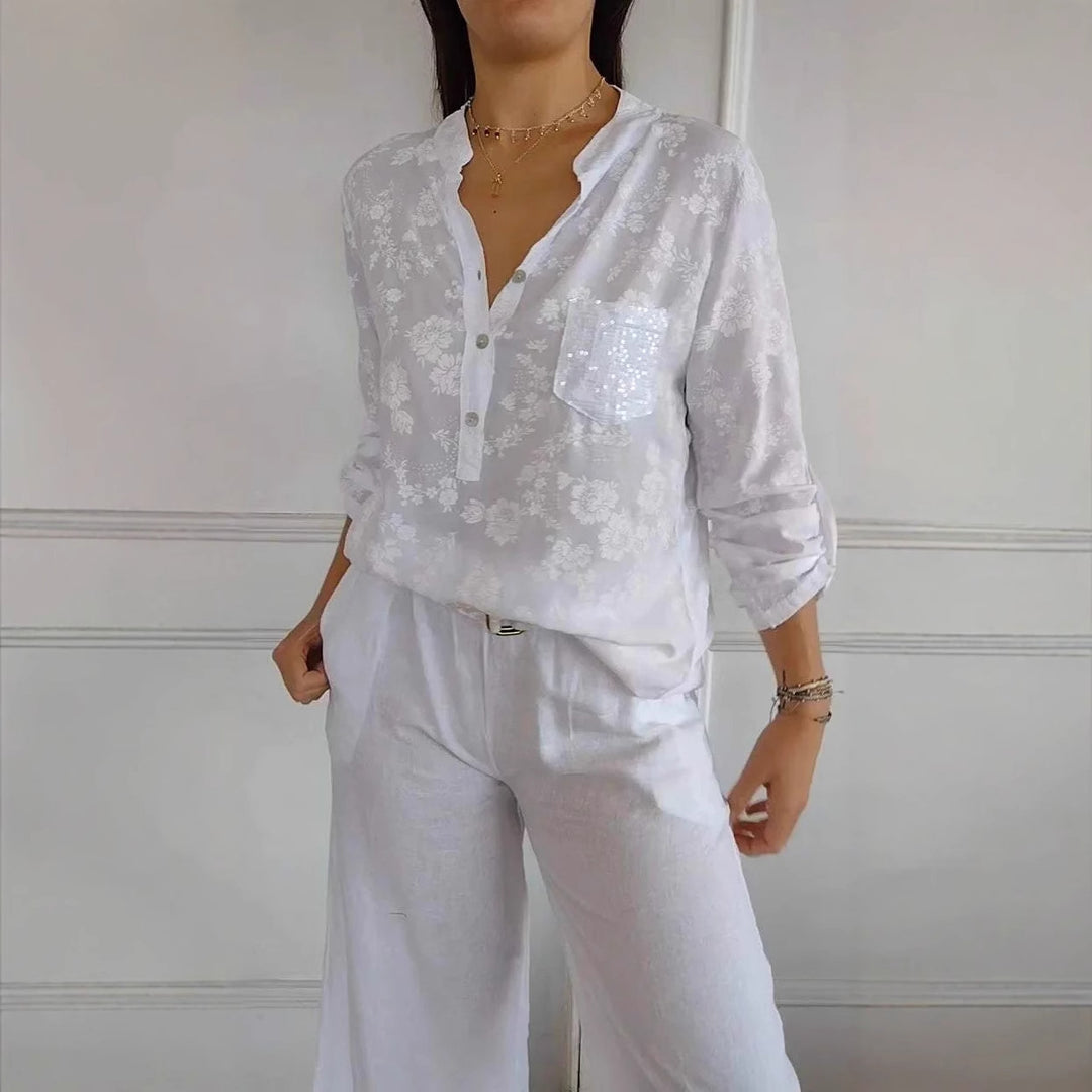 Damer blus skjorta med blommigt mönster och glittrande detalj Mirla-Eva Jonsson