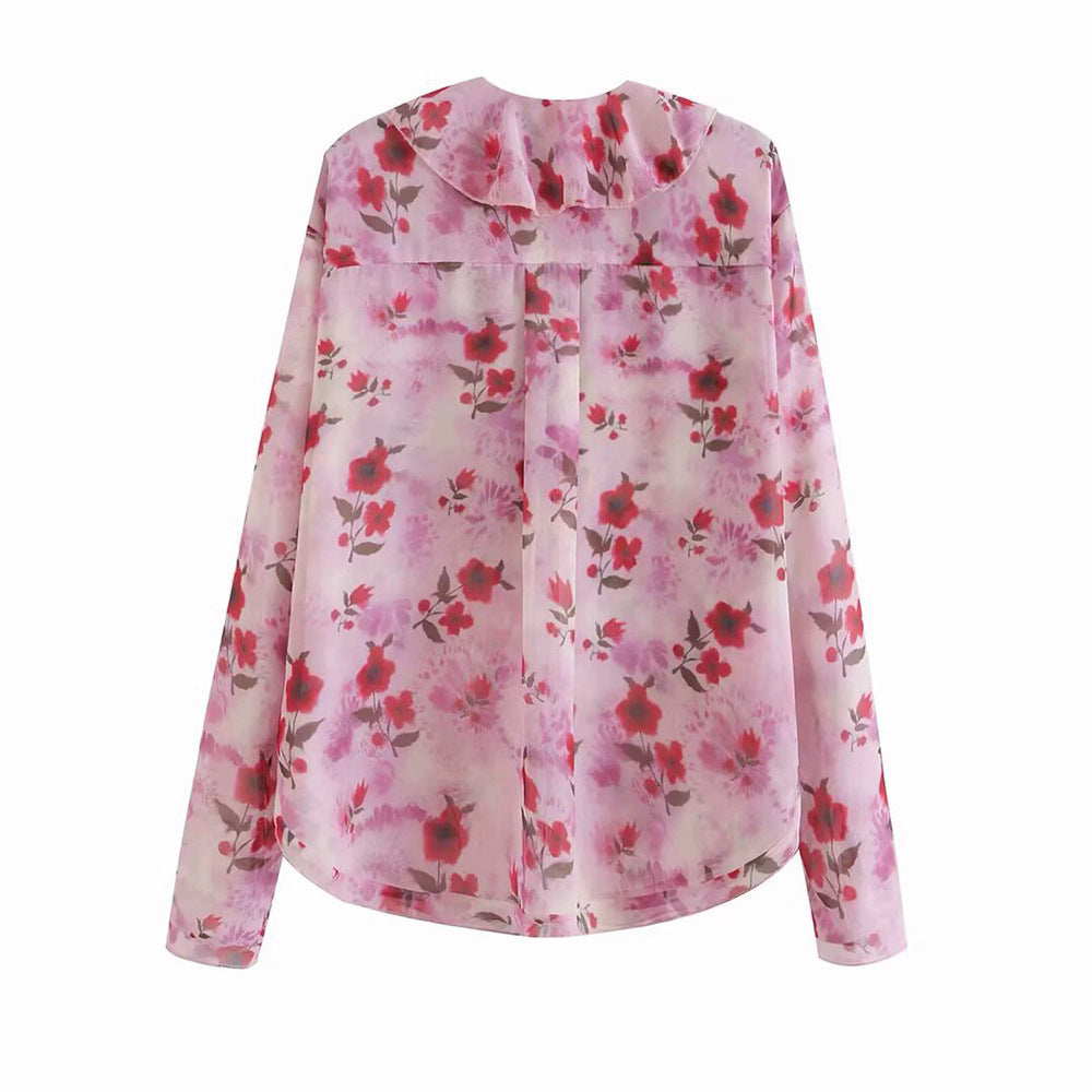 Damer blusblus med volangdesign och blommönster Mirla-Eva Jonsson