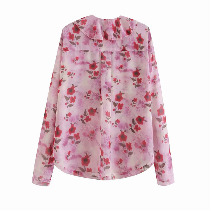 Damer blusblus med volangdesign och blommönster Mirla-Eva Jonsson