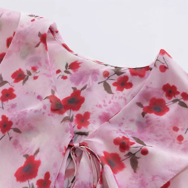 Damer blusblus med volangdesign och blommönster Mirla-Eva Jonsson