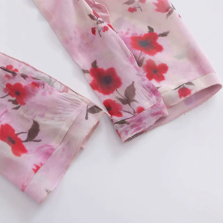 Damer blusblus med volangdesign och blommönster Mirla-Eva Jonsson