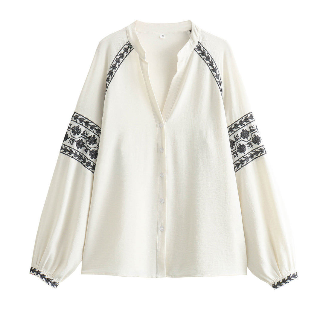 Damer broderad blus med moderna puffärmar och elegant ståkrage Mirla-Eva Jonsson