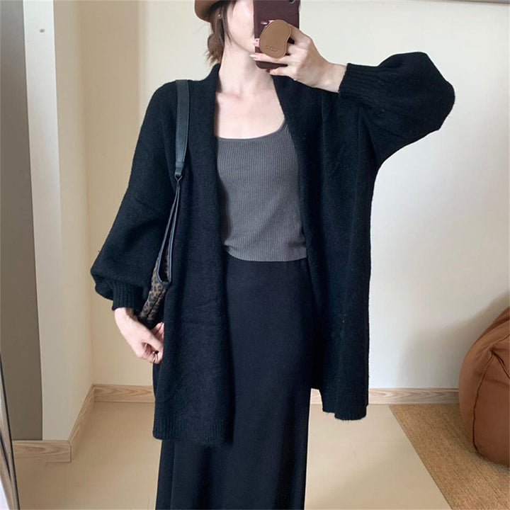 Damer cardigan i fin stickad material med avslappnad passform och långa ärmar Mirla-Eva Jonsson