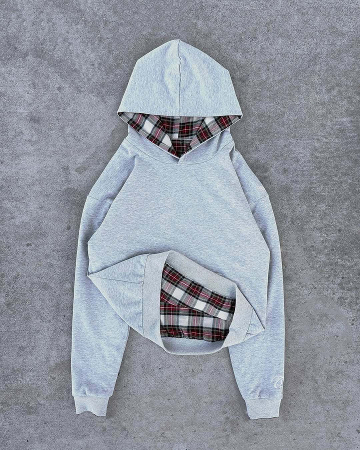 Damer casual hoodie med vadderad innerfoder och kontrasterande rutmönster Mirla-Eva Jonsson