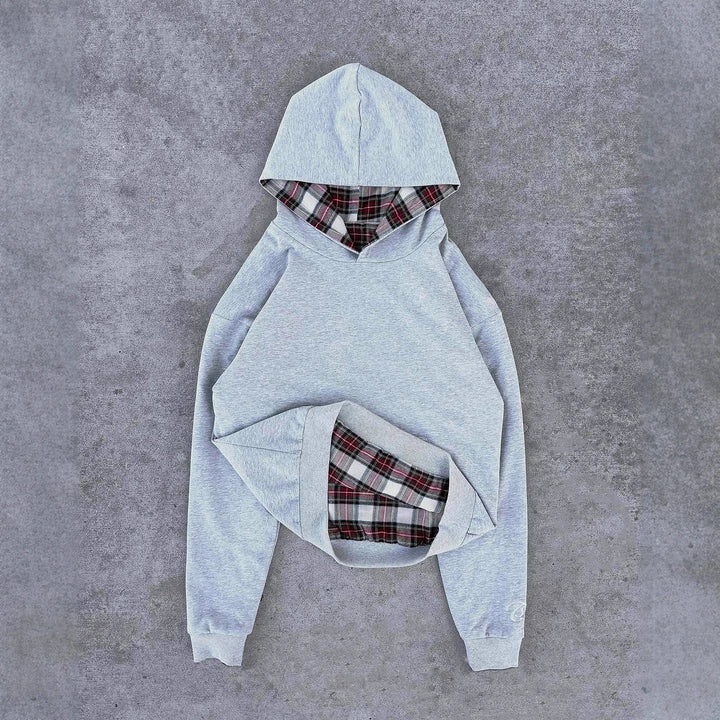 Damer casual hoodie med vadderad innerfoder och kontrasterande rutmönster Mirla-Eva Jonsson