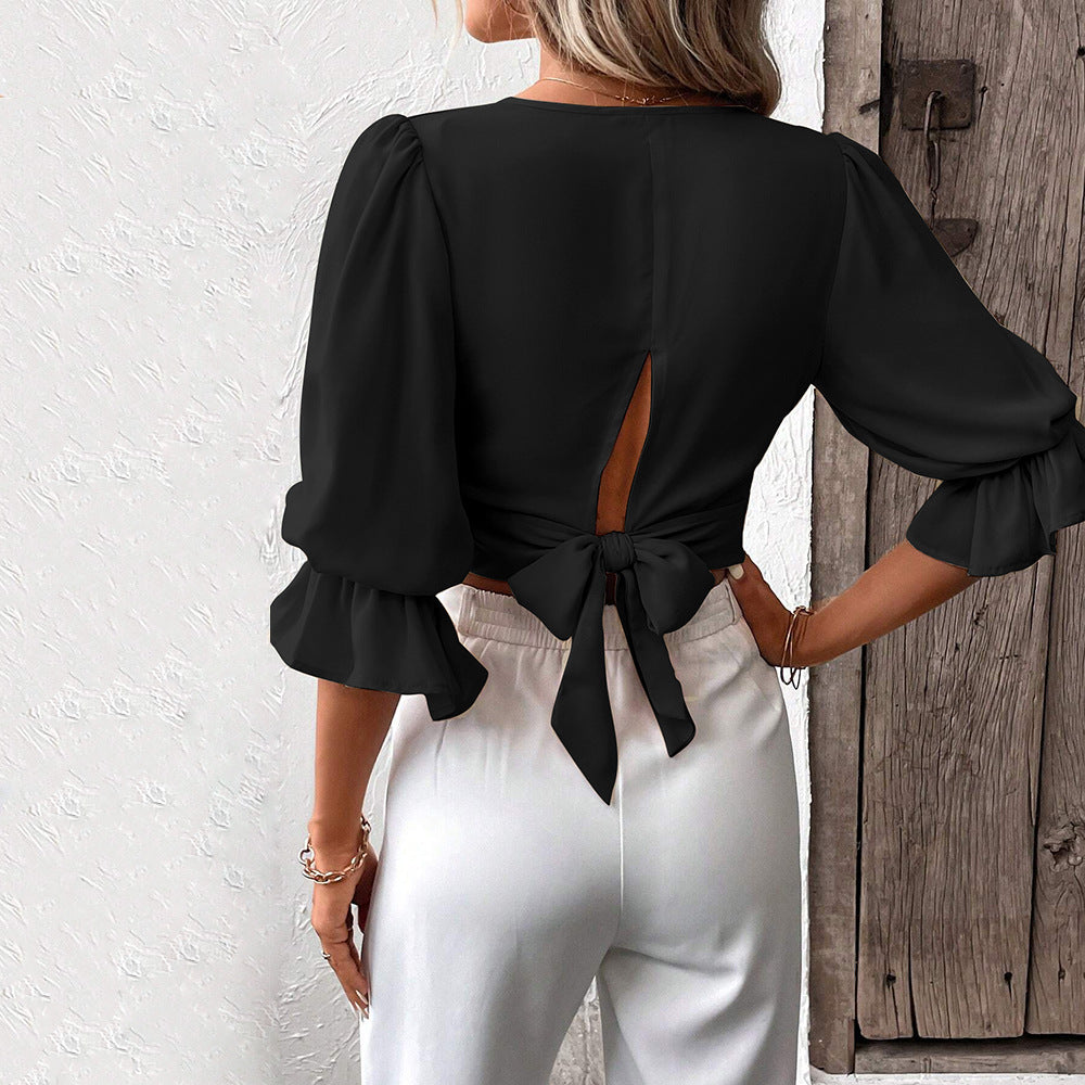 Damer chic crop top med eleganta puffärmar och V-hals Mirla-Eva Jonsson