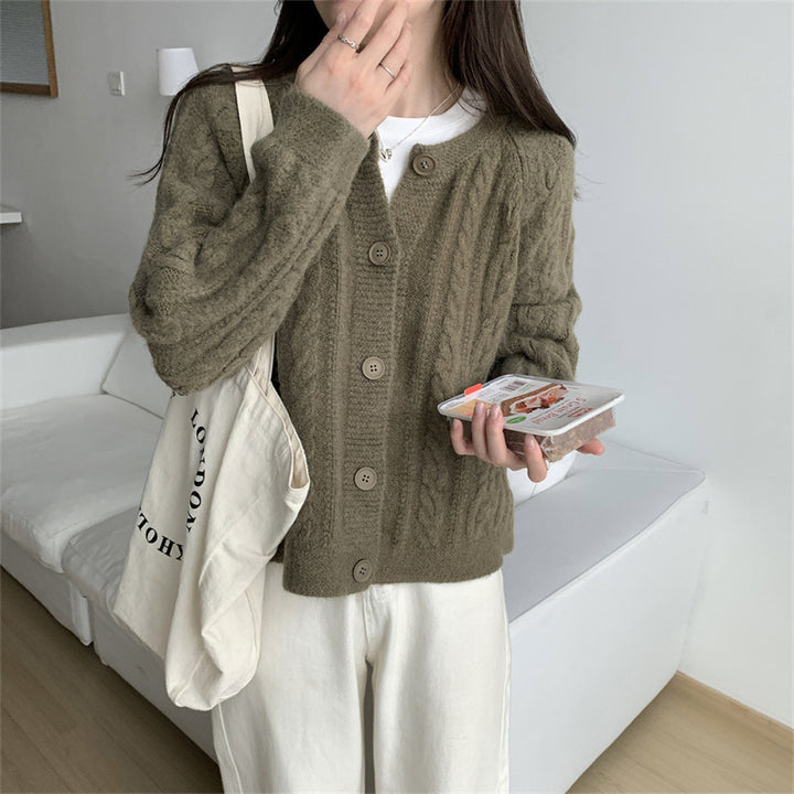 Damer chunky stickad cardigan med kabelmönster och vida ärmar Mirla-Eva Jonsson