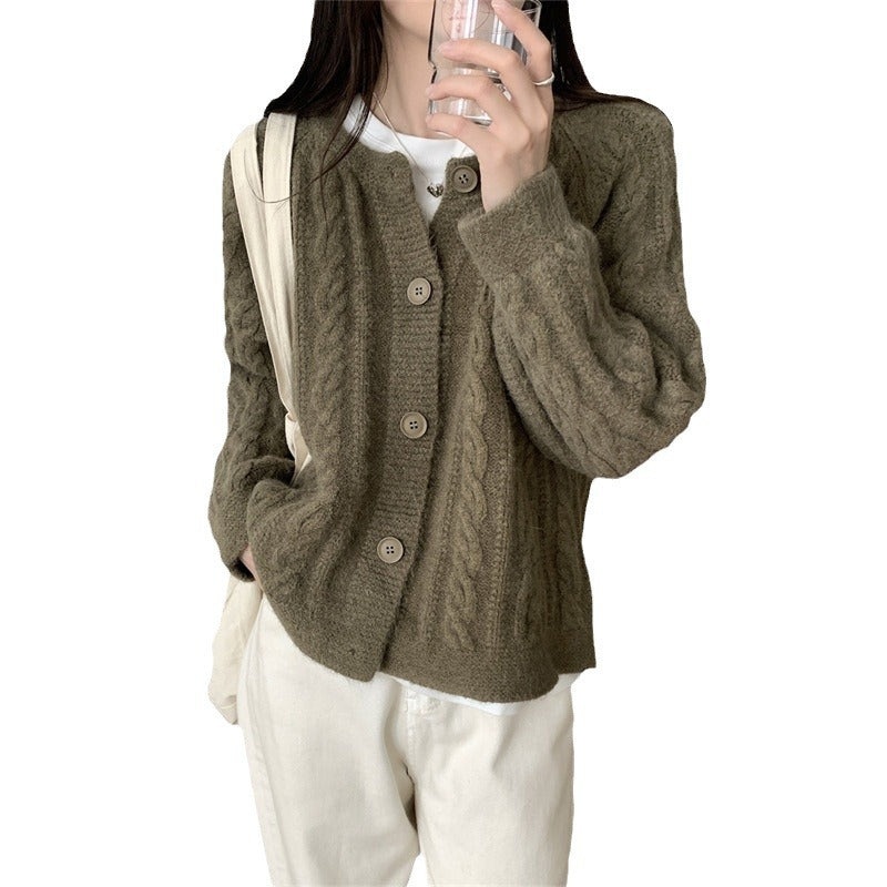 Damer chunky stickad cardigan med kabelmönster och vida ärmar Mirla-Eva Jonsson