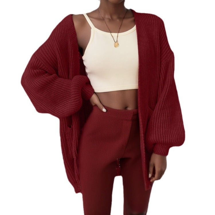Damer chunky stickad cardigan med voluminösa ärmar och praktiska fickor Mirla-Eva Jonsson