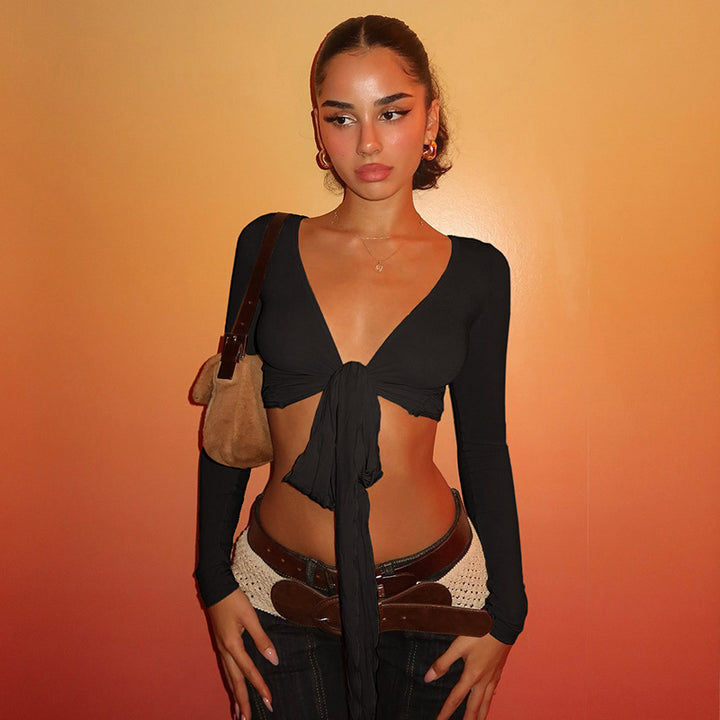 Damer crop top med lekfullt band och långa ärmar Mirla-Eva Jonsson