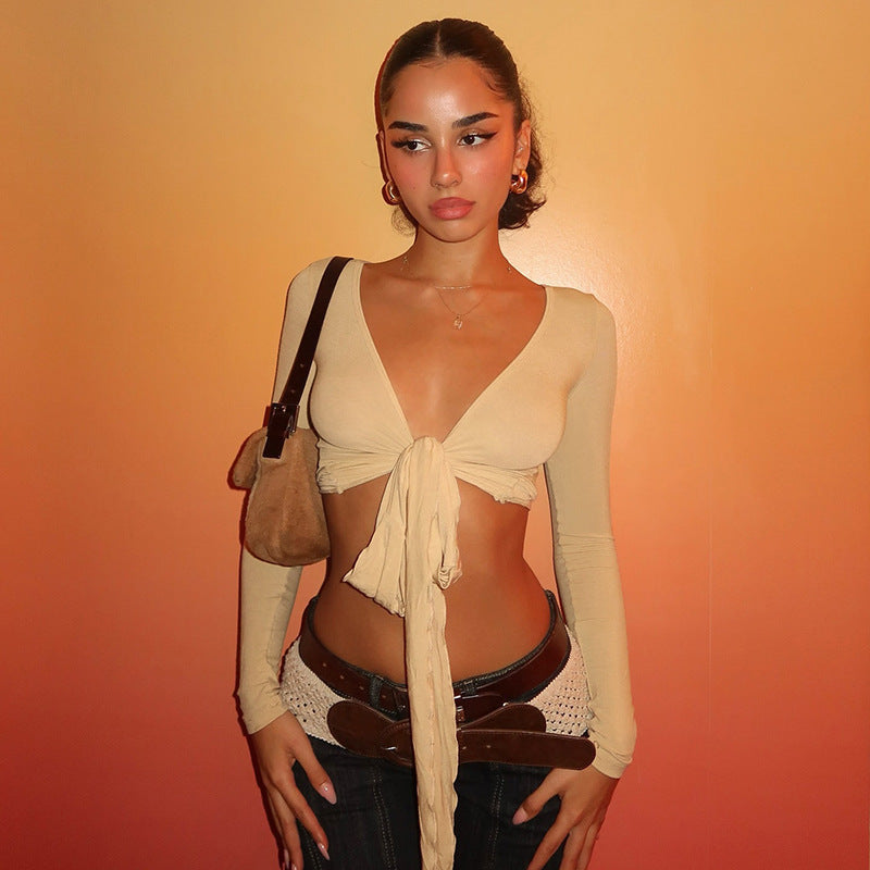 Damer crop top med lekfullt band och långa ärmar Mirla-Eva Jonsson