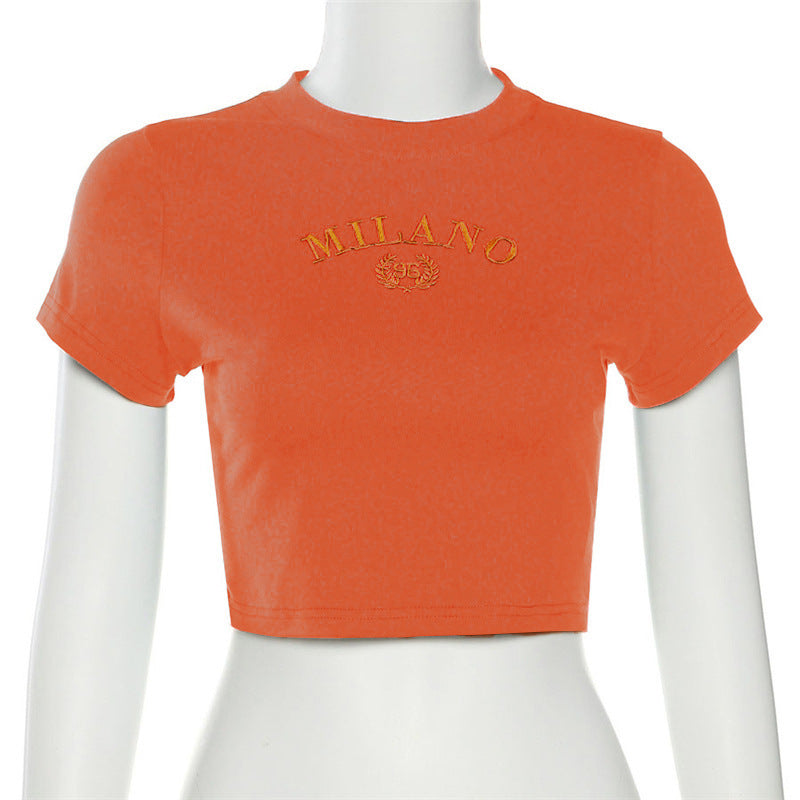 Damer cropped T-shirt med broderad text och rund halsringning Mirla-Eva Jonsson
